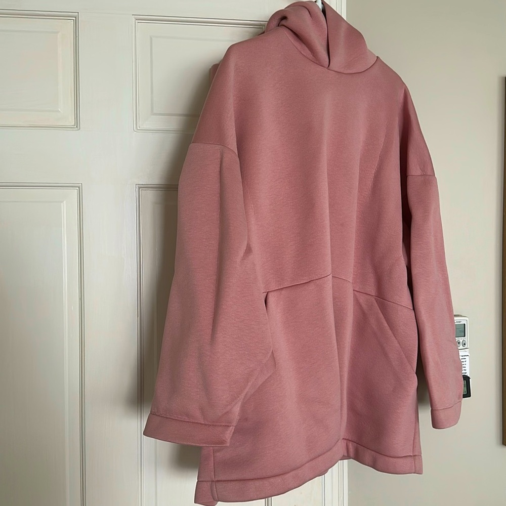 Cos brand oversized hoodie in a salmon color. Size M